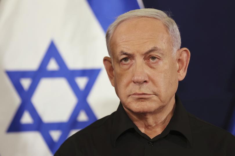 Israeli Prime Minister Benjamin Netanyahu attends a press conference with Defense Minister Yoav Gallant and Cabinet Minister Benny Gantz in the Kirya military base in Tel Aviv, Israel, Saturday, Oct. 28, 2023. (Abir Sultan/Pool Photo via AP)