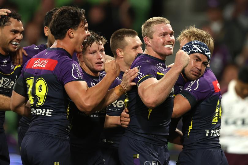 MELBOURNE, AUSTRALIA - APRIL 04:  Jahrome Hughes of the Storm celebrates with team mates after scoring a try during the round five NRL match between Melbourne Storm and Brisbane Broncos at AAMI Park on April 04, 2024, in Melbourne, Australia. (Photo by Robert Cianflone/Getty Images)