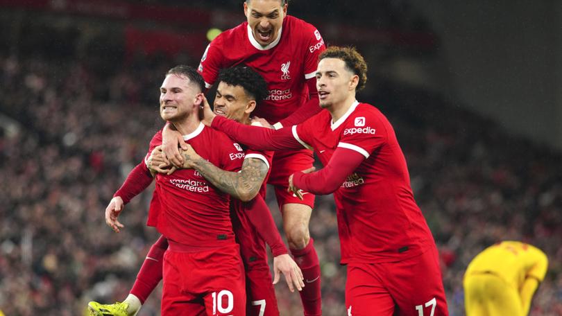 Liverpool teammates congratulate Alexis Mac Allister (centre) for his goal against Sheffield United.