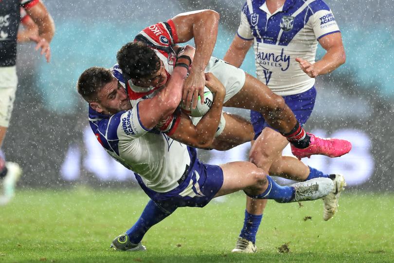 SYDNEY, AUSTRALIA - APRIL 05:  Joseph-Aukuso Suaalii of the Roosters is tackled during the round five NRL match between Canterbury Bulldogs and Sydney Roosters at Accor Stadium on April 05, 2024, in Sydney, Australia. (Photo by Cameron Spencer/Getty Images)