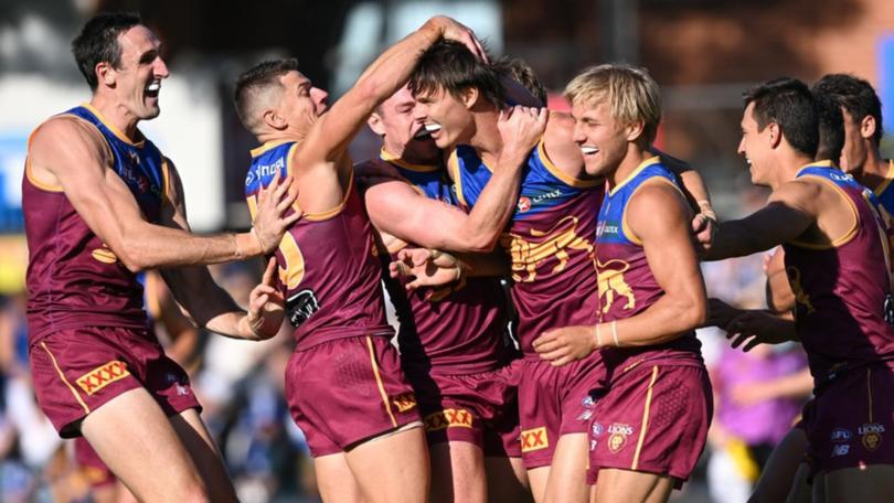 Eric Hipwood takes the congratulations after a return to form in Brisbane's big win. (Michael Errey/AAP PHOTOS)