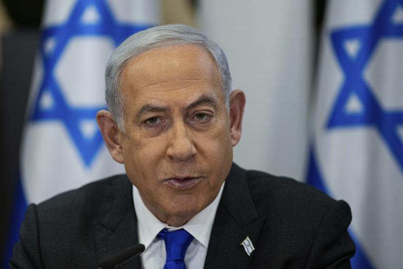 FILE - Israeli Prime Minister Benjamin Netanyahu chairs a cabinet meeting at the Kirya military base, which houses the Israeli Ministry of Defence, in Tel Aviv, Israel, Sunday, Dec . 24, 2023. Israel's Supreme Court on Monday, Jan. 1, 2024, struck down a key component of Netanyahu's contentious judicial overhaul, a decision that threatens to reopen the fissures in Israeli society that preceded the country's ongoing war against Hamas.(AP Photo/Ohad Zwigenberg, Pool, File)