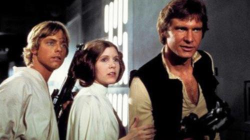 This photo provided by Twentieth Century Fox Home Entertainment shows, Mark Hamill, from left, as Luke Skywalker, Carrie Fisher as Princess Leia Organa, and Harrison Ford as Hans Solo in the original 1977 "Star Wars: Episode IV - A New Hope." The  four-day Star Wars Celebration kicked off Thursday, April 14, 2017 in Orlando, Fla., marking the 40-year anniversary of Lucasâ?? space saga. (Twentieth Century Fox Home Entertainment via AP)