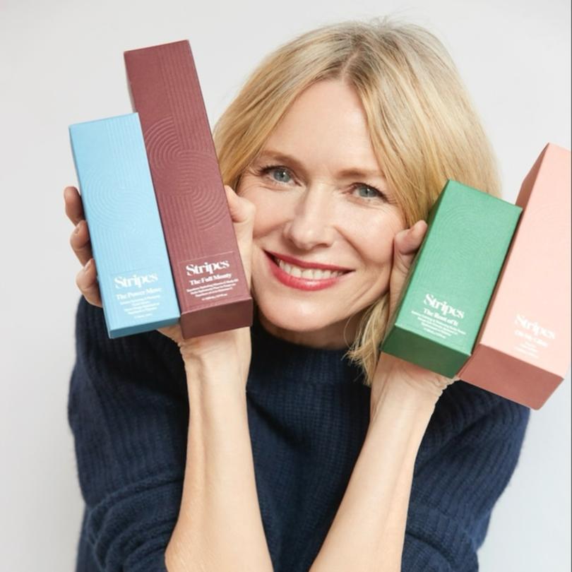 Naomi Watts with products from her menopause wellness brand, Stripes.