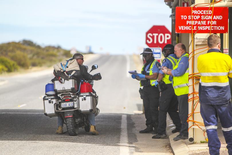 WA Police continue to man the border on Monday after the hard closure came into effect on midnight on Sunday. Mandurah motorcyclist Chris Joy was stopped as police referred his case to Perth to see what his fate would be.