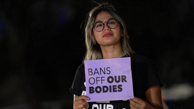 A woman outside the Arizona Supreme Court protests the abortion ruling for the US state.