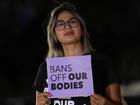 A woman outside the Arizona Supreme Court protests the abortion ruling for the US state.