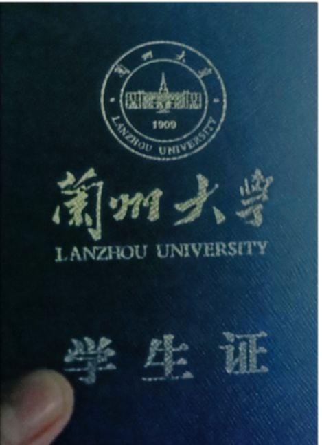 A student member of the hacking collective pictured holding their Lanzhou University student card