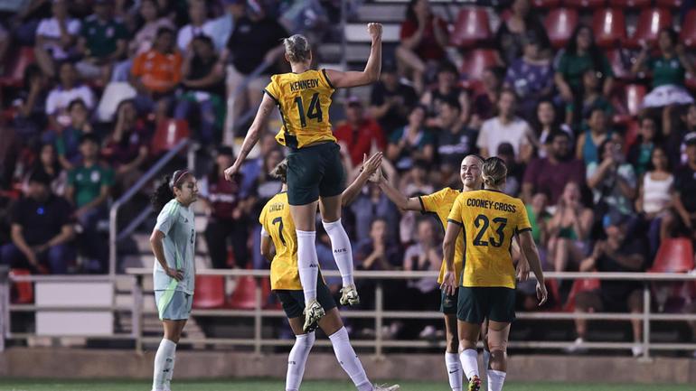 Caitlin Foord celebrates with her teammates after scoring Australia’s second goal.
