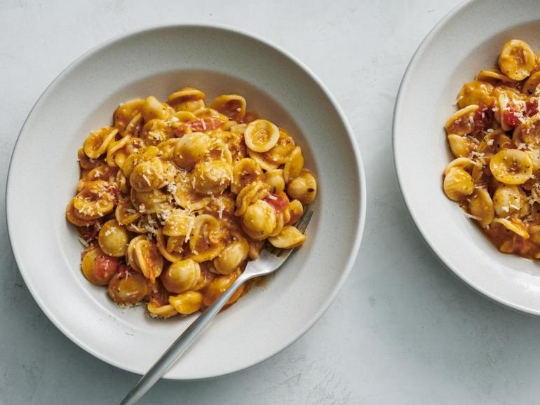 Roasted White Bean and Tomato Pasta. Caramelised tomatoes are paired with white beans in this season-bridging weeknight dinner. Food Stylist: Simon Andrews. (David Malosh/The New York Times)