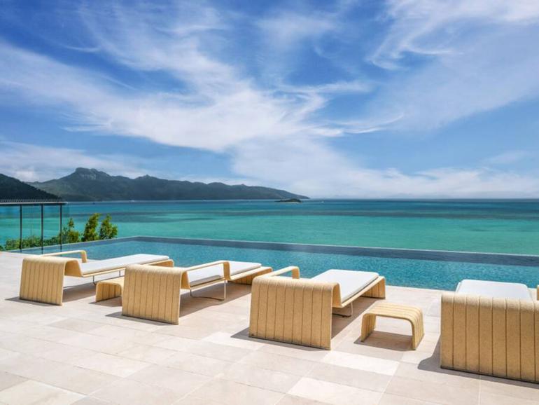 From the poolside lounges there are views across the Coral Sea and surrounding islands.