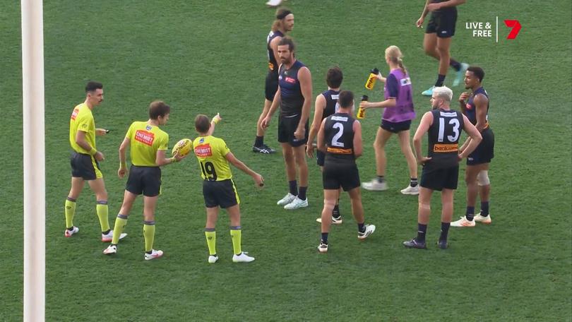 The umpires award a free kick against Jordan Clark. 