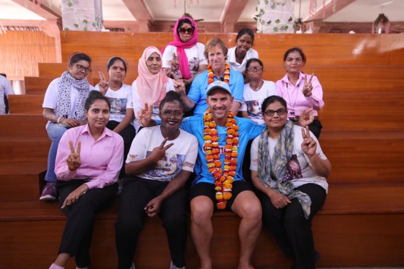 Justin Langer and Jonty Rhodes with the women and girls of Sheroes Hangout in Lucknow, India.