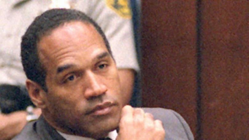 Former American football star and actor O.J. Simpson listens to testimony during his double murder trial in Los Angeles, March 16, 1995. 