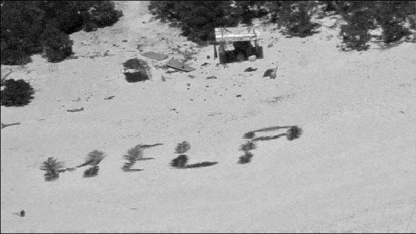 Three stranded mariners shaped palm fronds into a message for help spotted by a US navy aircraft.