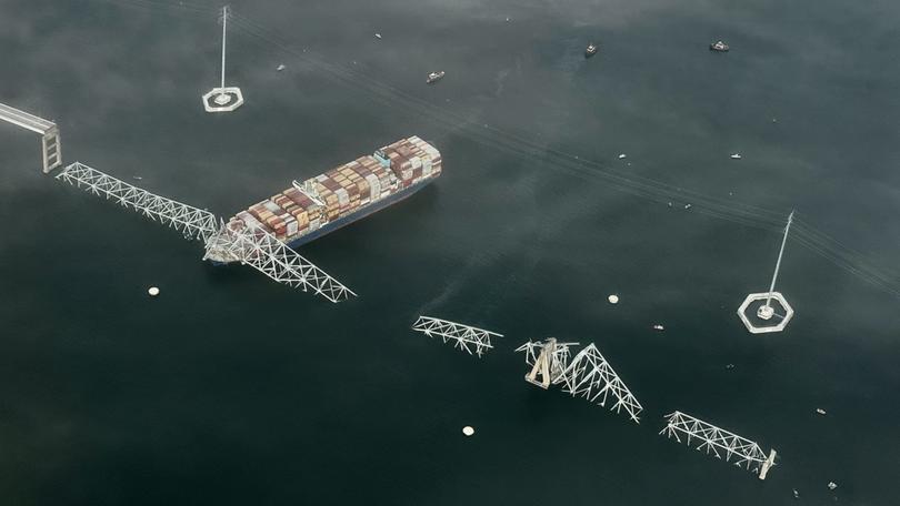 The Singapore-flagged container vessel Dali trapped under the collapsed Francis Scott Key Bridge in Baltimore.