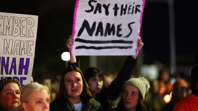 Members of the Ballarat community participate in a rally against men's violence following the alleged murder of three women in the regional Victorian city. 