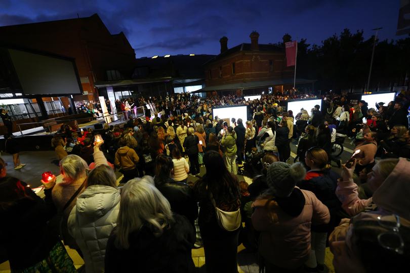 Members of the Ballarat community participate in a rally against men's violence at Ballarat Train Station.