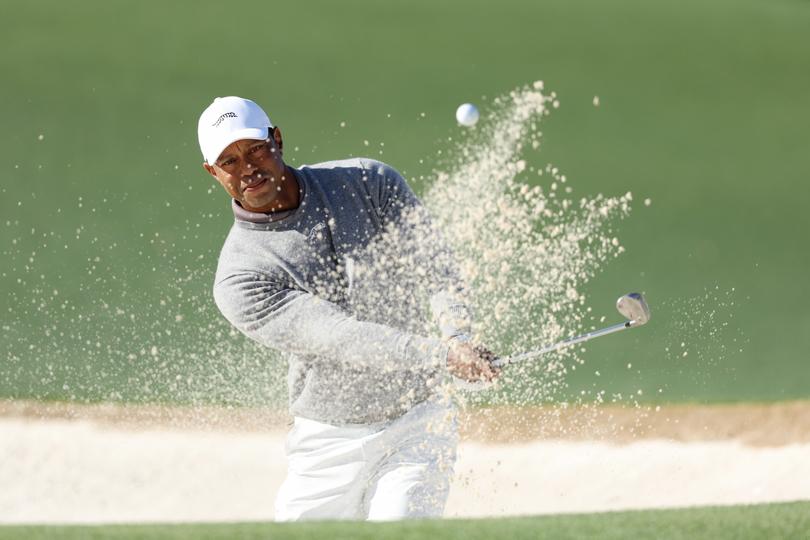 *** BESTPIX *** AUGUSTA, GEORGIA - APRIL 12: Tiger Woods of the United States plays a shot from a bunker on the 18th hole during the continuation of the first round of the 2024 Masters Tournament at Augusta National Golf Club on April 12, 2024 in Augusta, Georgia. (Photo by Warren Little/Getty Images)