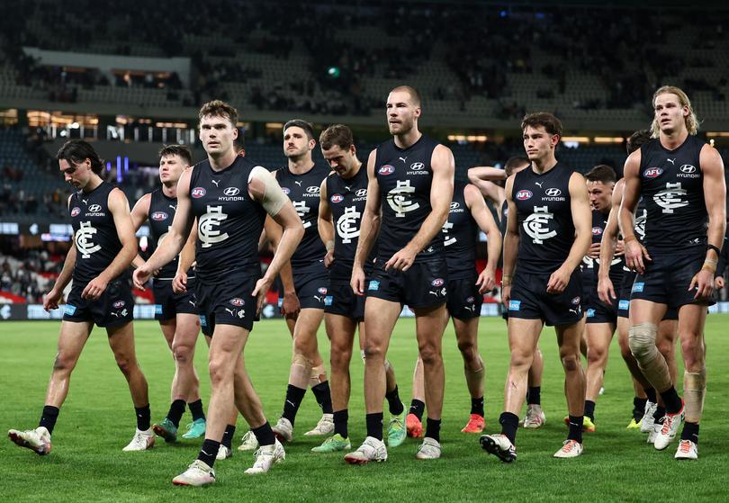 MELBOURNE, AUSTRALIA - APRIL 13: The Blues look dejected after losing the round five AFL match between Carlton Blues and Adelaide Crows at Marvel Stadium, on April 13, 2024, in Melbourne, Australia. (Photo by Quinn Rooney/Getty Images)