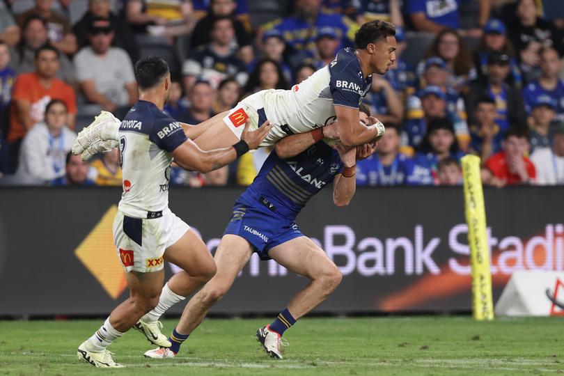 SYDNEY, AUSTRALIA - APRIL 13: Murray Taulagi of the Cowboys competes for the ball during the round six NRL match between Parramatta Eels and North Queensland Cowboys at CommBank Stadium on April 13, 2024 in Sydney, Australia. (Photo by Jason McCawley/Getty Images)