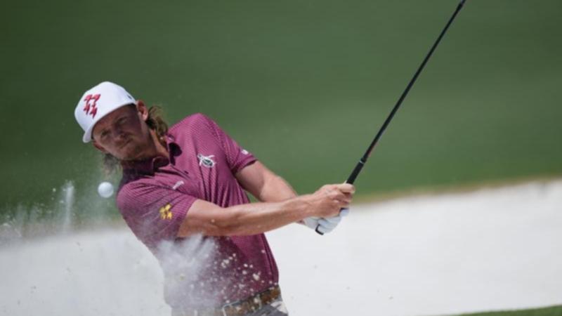 Cameron Smith splashes out of the bunker for a spectacular eagle on the second hole at Augusta. (AP PHOTO)