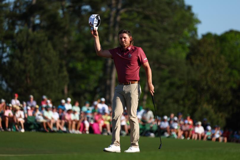AUGUSTA, GEORGIA - APRIL 14: Cameron Smith of Australia waves his hat to the crowd on the 18th green during the final round of the 2024 Masters Tournament at Augusta National Golf Club on April 14, 2024 in Augusta, Georgia. (Photo by Maddie Meyer/Getty Images)