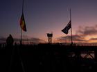 Flags on the Sydney Harbour Bridge fly at half mast after the massacre at Bondi Junction Westfield.