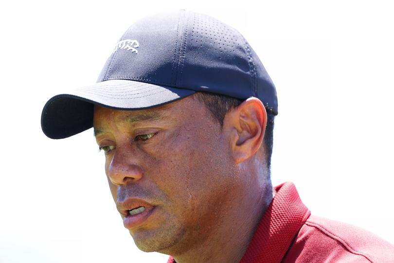 AUGUSTA, GEORGIA - APRIL 14: Tiger Woods of the United States walks off the 18th green after finishing his round during the final round of the 2024 Masters Tournament at Augusta National Golf Club on April 14, 2024 in Augusta, Georgia. (Photo by Andrew Redington/Getty Images)