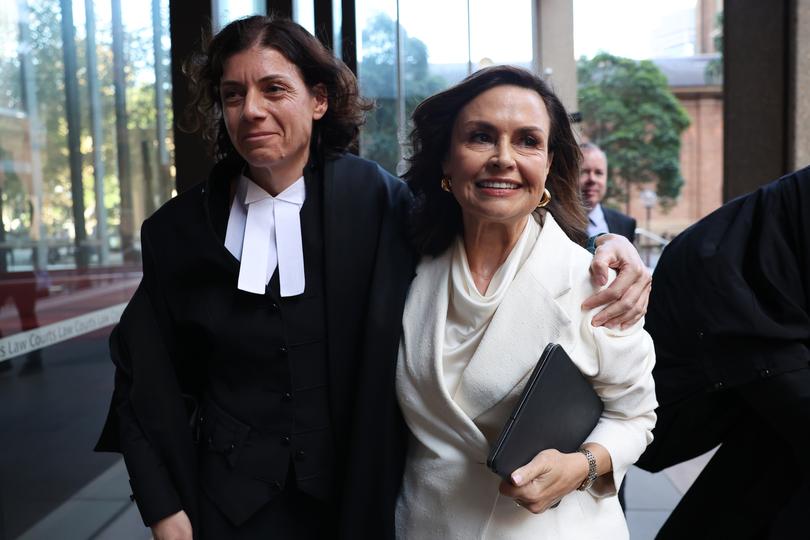 SYDNEY, AUSTRALIA - APRIL 15: Sue Chrysanthou SC hugs Lisa Wilkinson as they emerge from court on April 15, 2024 in Sydney, Australia. Justice Michael Lee has ruled in favour of Network Ten and journalist Lisa Wilkinson in Bruce Lehrmann's defamation case. The case arose from allegations aired on 'The Project' news program, in which Brittany Higgins claimed she was raped by a colleague in Parliament House. Lehrmann, who denied any sexual contact with Ms Higgins, alleged defamation by the broadcast, despite not being explicitly named. The court found that Lehrmann had raped Brittany Higgins on the balance of probabilities.  (Photo by Don Arnold/Getty Images)