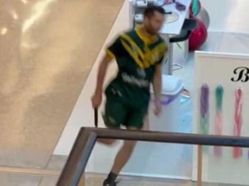 Photo shows the knifeman running through Bondi Junction Westfield. Twitter