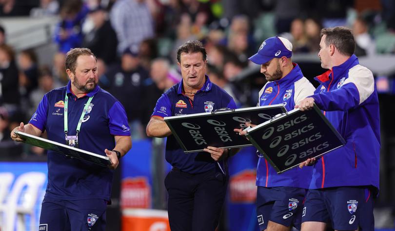 ADELAIDE, AUSTRALIA - APRIL 06: Luke Beveridge, Senior Coach of the Bulldogs with coaching staff during the 2024 AFL Round 04 match between the Western Bulldogs and the Geelong Cats at Adelaide Oval on April 06, 2024 in Adelaide, Australia. (Photo by Sarah Reed/AFL Photos via Getty Images)