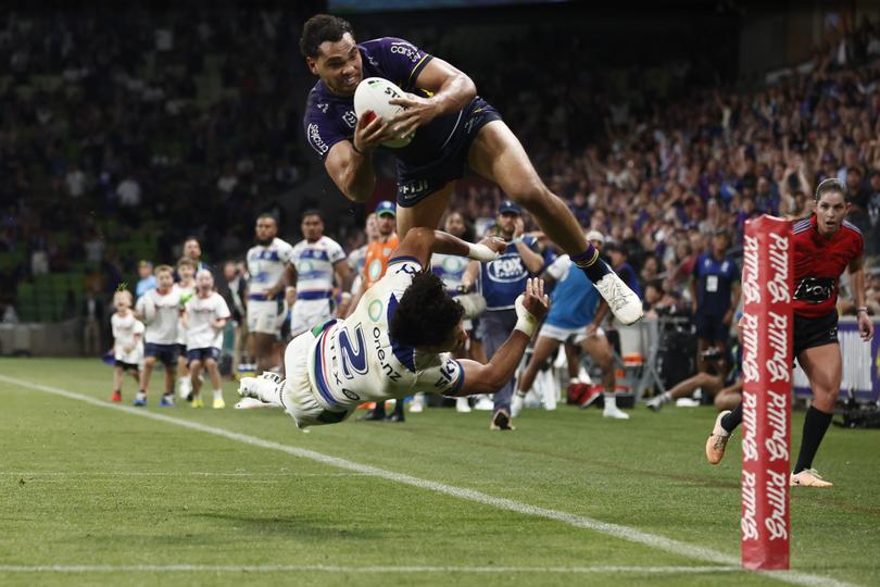 MELBOURNE, AUSTRALIA - MARCH 16: Xavier Coates of the Storm scores the match winning try during the round two NRL match between Melbourne Storm and New Zealand Warriors at AAMI Park, on March 16, 2024, in Melbourne, Australia. (Photo by Daniel Pockett/Getty Images)