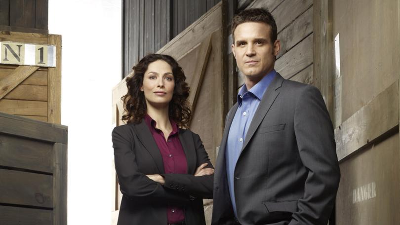 Cast of Warehouse 13 - Joanne Kelly and Eddie McClintock.
