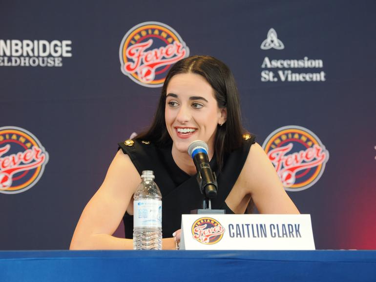 Caitlin Clark of the Indiana Fever talks to the media.