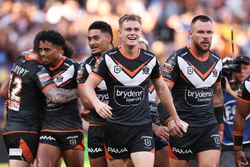 SYDNEY, AUSTRALIA - APRIL 01:  Lachlan Galvin of the Tigers celebrates victory with team mates after the round four NRL match between Parramatta Eels and Wests Tigers at CommBank Stadium, on April 01, 2024, in Sydney, Australia. (Photo by Matt King/Getty Images)