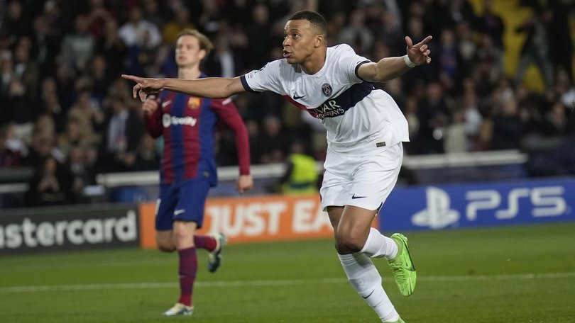 A Kylian Mbappe brace has led PSG past Barcelona and into the Champions League final four. (AP PHOTO)