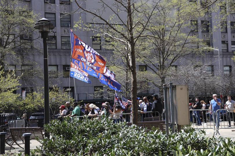 Supporters of former President Donald Trump gather outside the courthouse. (Jefferson Siegel/The New York Times)