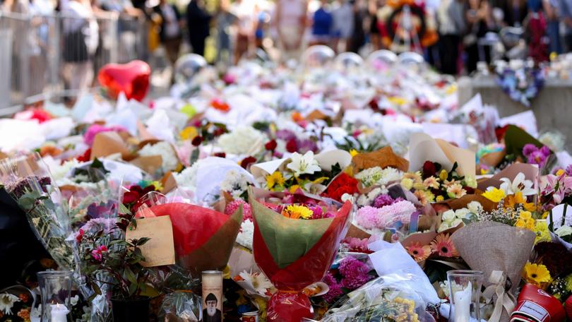 Flowers are placed outside Westfield Bondi Junction to honour the victims of the stabbing.