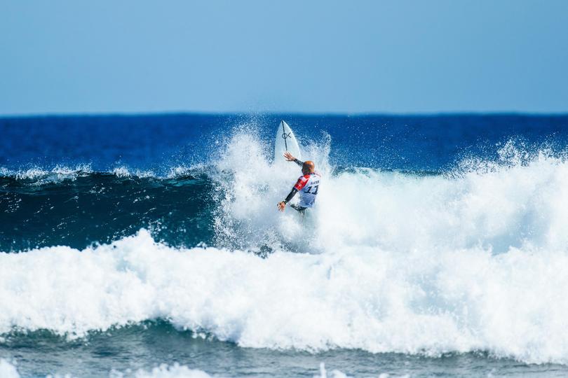 Kelly Slater surfs his heat. 