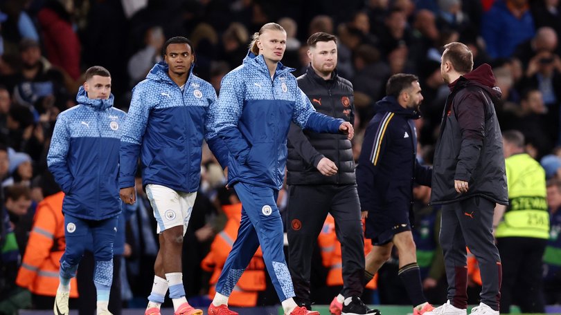 Erling Haaland and Manuel Akanji of Manchester City look dejected after the team's defeat.