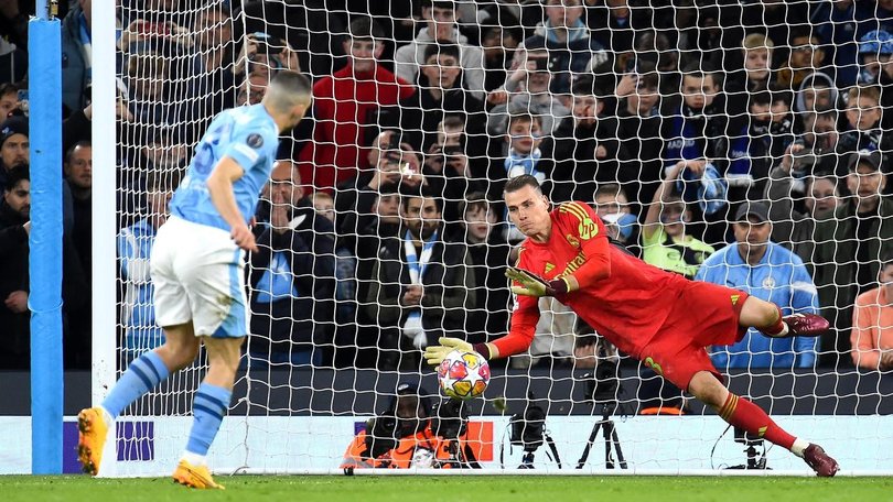 Real Madrid keeper Andriy Lunin saves Mateo Kovacic's penalty.