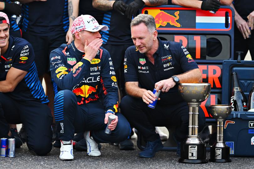 SUZUKA, JAPAN - APRIL 07: Race winner Max Verstappen of the Netherlands and Oracle Red Bull Racing talks with Oracle Red Bull Racing Team Principal Christian Horner as they celebrate with their team after the F1 Grand Prix of Japan at Suzuka International Racing Course on April 07, 2024 in Suzuka, Japan. (Photo by Clive Mason/Getty Images)