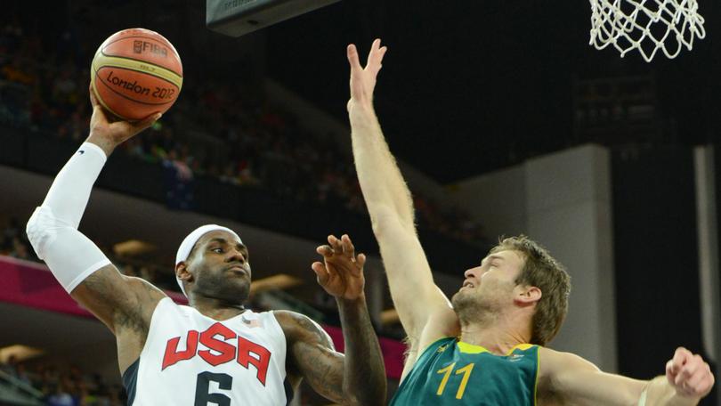 US forward LeBron James scores past Australian forward Mark Worthington during their London 2012 Olympic Games