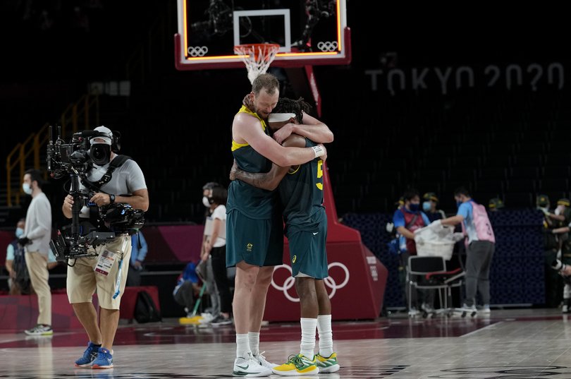 Australia's Joe Ingles (7) and Patty Mills (5) react after beating Slovenia 107-93 during the men's bronze medal basketball game at the 2020 Summer Olympics, Saturday, Aug. 7, 2021, in Tokyo, Japan. (AP Photo/Eric Gay)