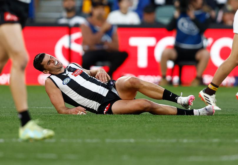 ADELAIDE, AUSTRALIA - APRIL 07: Scott Pendlebury of the Magpies lays injured during the 2024 AFL Round 04 match between the Collingwood Magpies and the Hawthorn Hawks at Adelaide Oval on April 07, 2024 in Adelaide, Australia. (Photo by Michael Willson/AFL Photos via Getty Images)