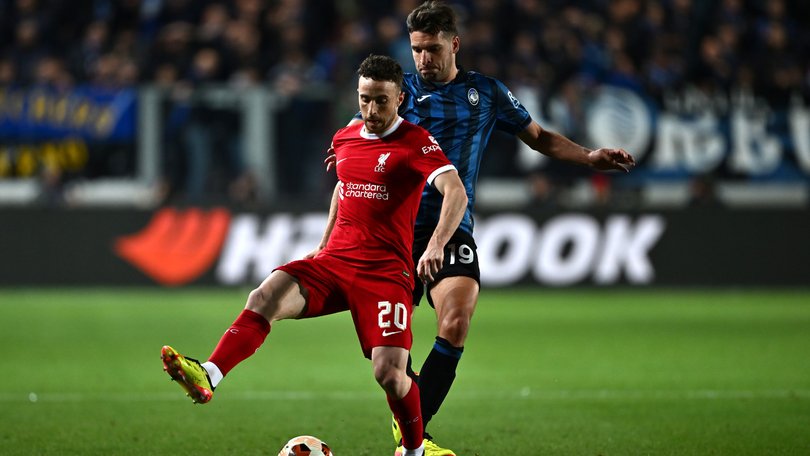 Diogo Jota of Liverpool is challenged by Berat Djimsiti of Atalanta.