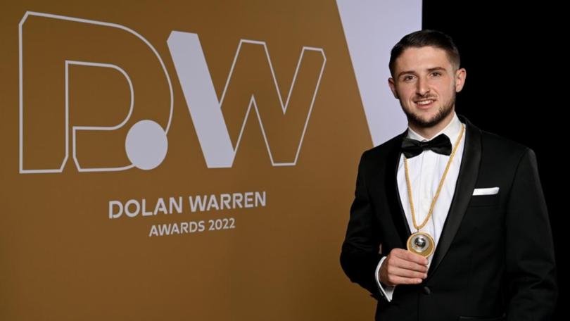 Melbourne Victory's Jake Brimmer proudly displays the Johnny Warren Medal he won in 2022. (Bianca De Marchi/AAP PHOTOS)