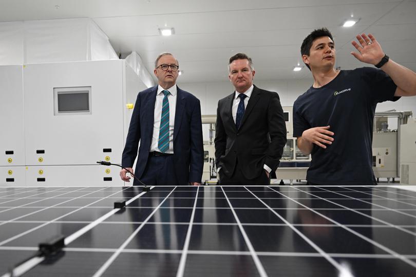Prime MInister Anthony Albanese (left) and Minister for Climate Change and Energy, Chris Bowen (centre) with founder and CEO Vince Allen (right) during a visit to Sundrive in Sydney, Wednesday, November 1, 2023. Sundrive is Australia’s first mass production facility for solar panels. (AAP Image/Dean Lewins) NO ARCHIVING