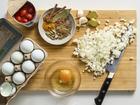 Ingredients for skillet eggs with garam masala and tomatoes. This heady, aromatic meal goes well alongside toast or nestled on a bed of rice. Food styled by Rebecca Jurkevich. 